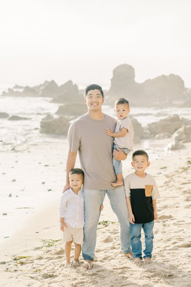 Father and kids on beach