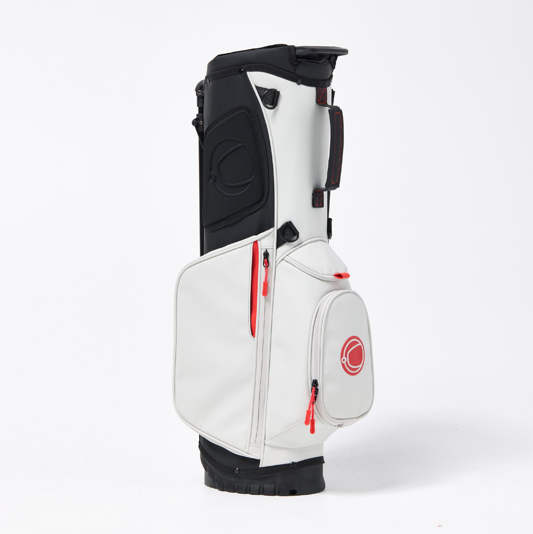 White golf bag with black accents and red zippers on a white background