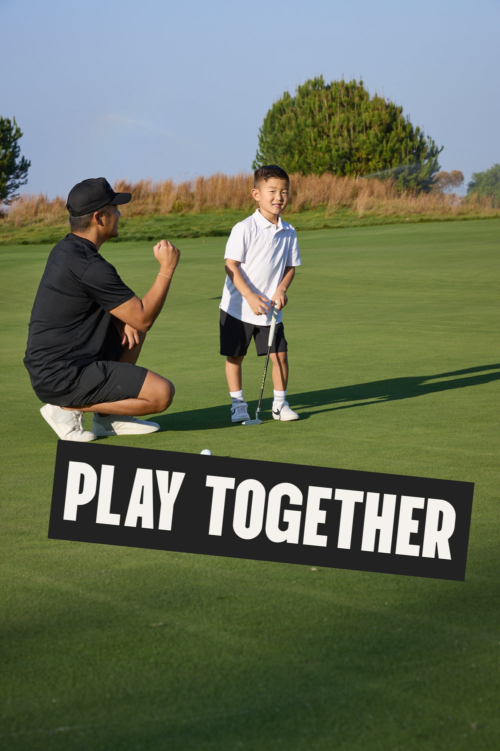 Man and child on a golf course with 'Play Together' sign
