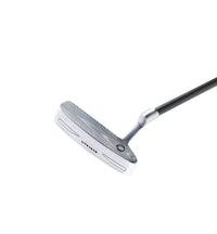 Golf putter with a black shaft on a white background