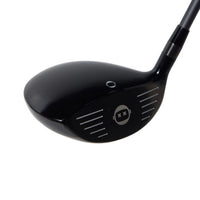 Black golf club head on a white background